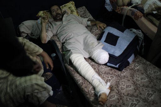 FILE - In this April 3, 2011 file photo, an injured Libyan man who lost one of his legs is seen on board the Turkish ship Ankara, carrying 250 wounded from Misrata that docked at the port of Benghazi, Libya. More than 40 days of siege, shelling and sniper fire by Moammar Gadhafi's forces have exacted a bloody price in rebel-held Misrata, Libya's third-largest city and a coveted prize in the increasingly deadlocked civil war. (AP Photo/Nasser Nasser, File) (AP)