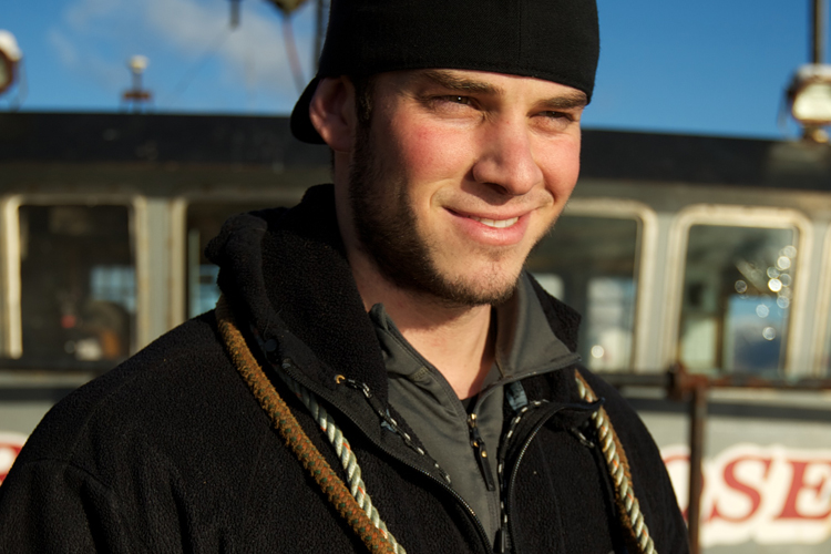 Ramblin' Rose Deckhand James Creel works to prepare the boat for fishing during "Deadliest Catch" Season 7 in Dutch Harbor, Alaska.