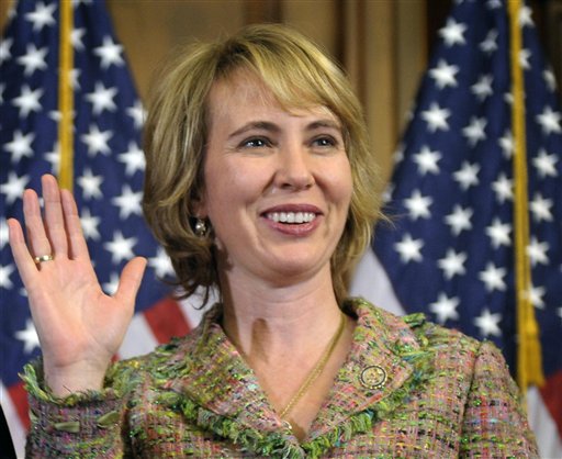FILE - In this Jan. 5, 2011 file photo, Rep. Gabrielle Giffords, D-Ariz., takes part in a reenactment of her swearing-in, on Capitol Hill in Washington. Time magazine has named Giffords one of the 100 most influential people in the world. (AP Photo/Susan Walsh, File) (AP)
