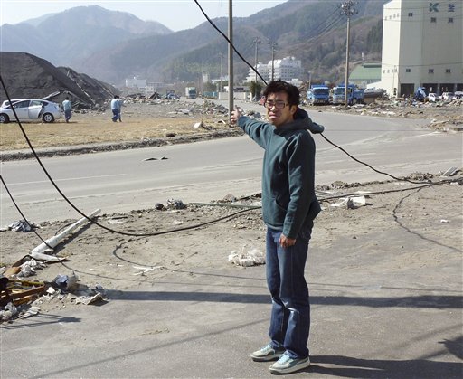 Toya Chiba, a reporter with the Iwate Tokai newspaper, recounts his ordeal with the tsunami that swept him away at the port city of Kamaishi, northeastern Japan, on Wednesday April 13, 2011. The region was struck by a massive earthquake that spawned the tsunami on March 11, 2011.  Chiba, who was shooting photos at the mouth of the Owatari River when the tsunami struck him, survived and found himself only suffering scratches and bruises after being swept away for about 30 meters (98 feet). (AP Photo/Kyodo News)  JAPAN OUT, MANDATORY CREDIT, NO LICENSING IN CHINA, HONG KONG, JAPAN, SOUTH KOREA AND FRANCE (AP)