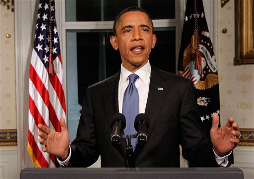 President Obama poses for photographers in the Blue Room at the White House in Washington after he spoke regarding the budget and averted government shutdown after a deal was made between Republican and Democrat lawmakers, Friday, April 8, 2011. (AP Photo/Charles Dharapak) (AP)