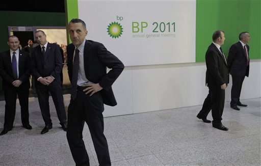 Security personnel guard the entrance to the conference center where BP held its annual general meeting of its shareholders, in London, Thursday, April 14, 2011. BP's annual shareholder meeting got off to a rowdy start on Thursday as crowds of protesters watched over by police held noisy demonstrations outside the venue.(AP Photo/Lefteris Pitarakis) (AP)