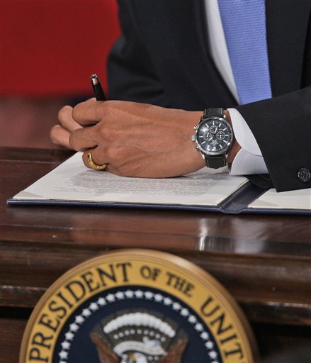 FILE - In this Jan. 21, 2009, file photo President Barack Obama signs one of five executive orders his first day on the job at the Eisenhower Executive Office Building in Washington. Two years into its pledge to improve government transparency, the Obama administration handled fewer requests for federal records from citizens, journalists, companies and others last year even as significantly more people asked for information.  (AP Photo/Ron Edmonds, File) (AP)