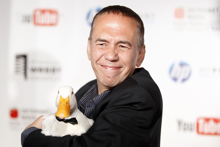 Comedian Gilbert Gottfried arrives with a duck at the Webby Awards in New York June 14, 2010. REUTERS/Lucas Jackson (UNITED STATES - Tags: ENTERTAINMENT ANIMALS) (Â© Lucas Jackson / Reuters)