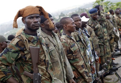 Soldiers loyal to Alassane Ouattara line up to be addressed by a commanding officer, at a republican forces operating base in the Youpougon neighborhood, on the outskirts of Abidjan, Ivory Coast, Friday, April 8, 2011. Ivory Coast's democratically elected leader said his forces won't capture the entrenched strongman who remained holed up Friday in an underground bunker at the presidential residence, and instead will focus on normalizing life in the besieged city.(AP Photo/Rebecca Blackwell) (AP)