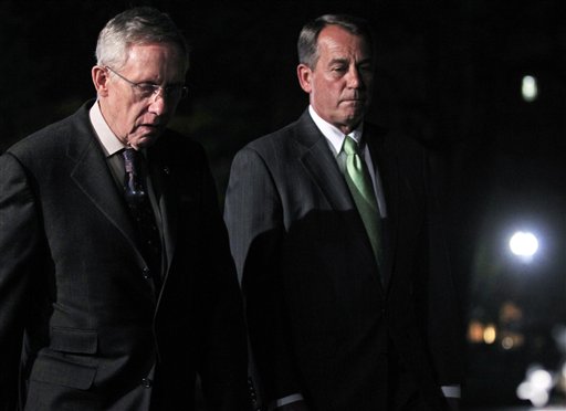 House Speaker John Boehner, R-Ohio, and Senate Majority Leader Harry Reid, D-Nev., walk out to speak to reporters after their meeting at the White House in Washington with President Obama regarding the budget and possible government shutdown, Wednesday, April 6, 2011. (AP Photo/Charles Dharapak) (AP)