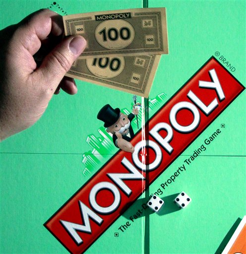 A MONOPOLY Property Trading Game is shown Wednesday, April, 13, 2011, in Portland, Ore.Hasbro said Thursday, April 14, 2011, its first-quarter profit tumbled 71 percent as weakness persisted in games, puzzles and several other product categories and the company spent money to develop new products and staff its joint-venture TV station. (AP Photo/Rick Bowmer) (AP)