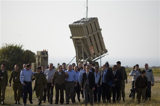 Israeli Prime Minister Benjamin Netanyahu, center right, and Defense Minster Ehud Barak, center left, visit the Iron Dome missile defense system, background, deployed in Ashkelon, southern Israel, Sunday, April 10, 2011. A senior member of Gaza's ruling Hamas movement on Sunday made a rare appeal to the Israeli public to halt escalating cross-border fighting, telling an Israeli radio station in fluent Hebrew that Hamas is ready to stop its rocket fire if Israel ends its attacks on Gaza. (AP Photo/Ariel Schalit) (AP)