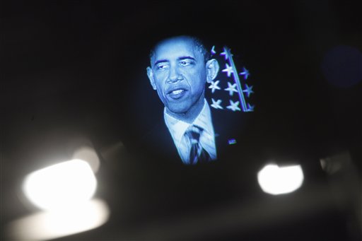 President Barack Obama is seen in a television monitor as he outlines his fiscal policy during an address at George Washington University in Washington, Wednesday, April 13, 2011.  (AP Photo/Charles Dharapak) (AP)
