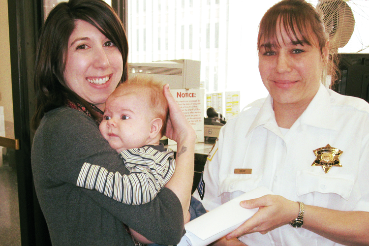 The author's wife and son with a sheriff's officer