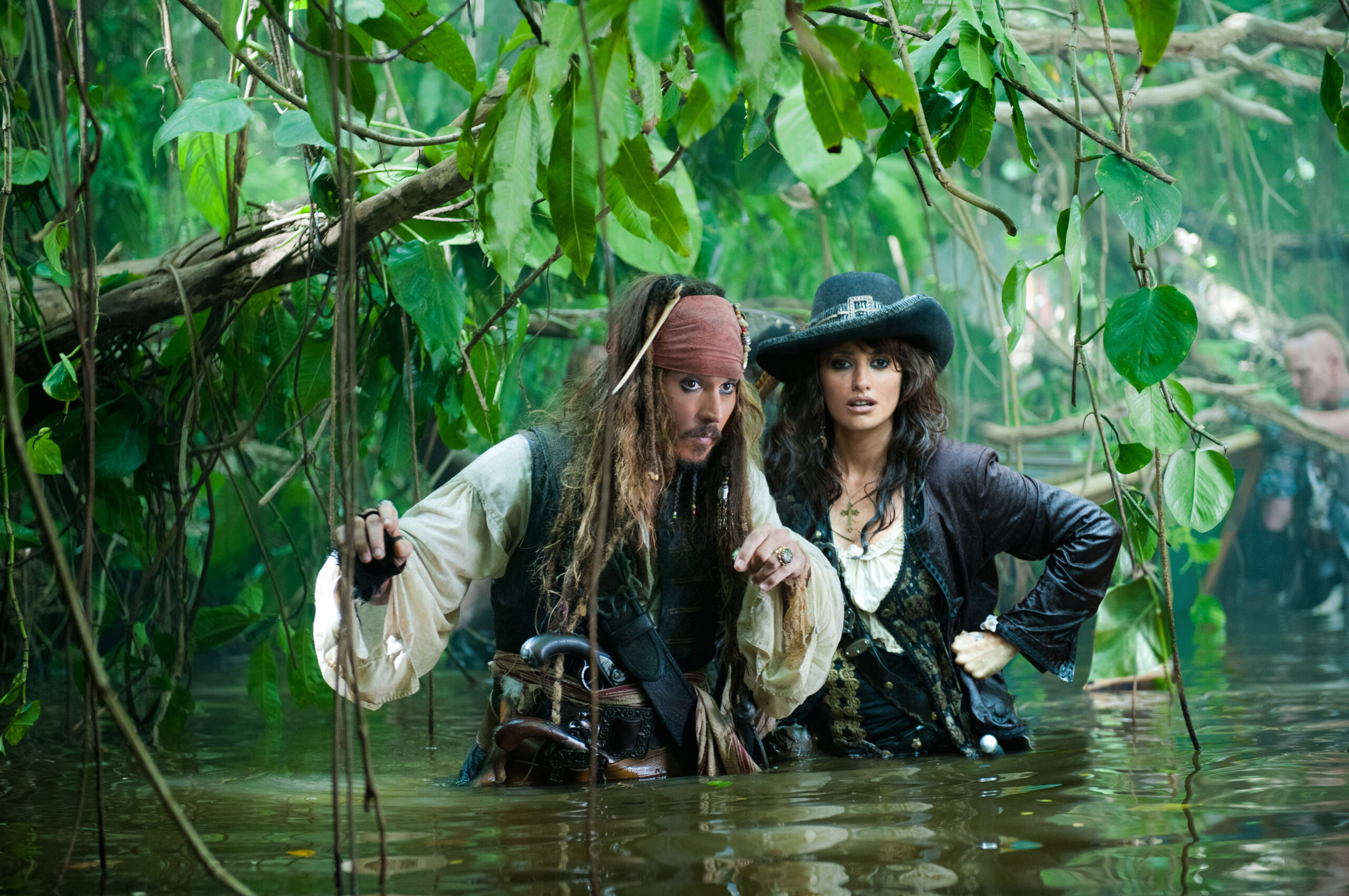 "PIRATES OF THE CARIBBEAN: ON STRANGER TIDES"

Captain Jack (JOHNNY DEPP) and Angelica (PENELOPE CRUZ) make their watery way through the jungle in search of the Fountain of Youth.

Ph: Peter Mountain

Â©Disney Enterprises, Inc.  All Rights Reserved. (Peter Mountain)