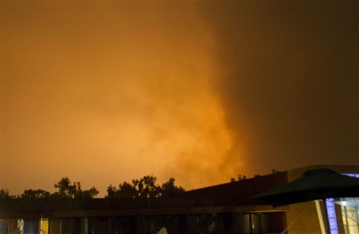 Sky over Tripoli, Libya, is illuminated by explosions during an airstrike, early Tuesday, May 24, 2011. NATO warplanes were repeatedly hitting Tripoli early Tuesday in what appears to be the heaviest night of bombing of the Libyan capital since the start of the air campaign against Moammar Gadhafi's forces. (AP Photo/Darko Bandic) (AP)