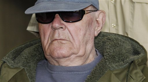 John Demjanjuk arrives at the court building in Munich, southern Germany, on Wednesday, May 11, 2011. Ukrainian-born Demjanjuk, 91, is accused of 28,060 counts of accessory to murder for allegedly serving as a guard in the Nazis' Sobibor death camp. (AP Photo/Matthias Schrader) (AP)