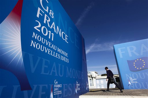 A man walks in front of the Deauville Congress Center, in Deauville, western France  on Monday, May 23, 2011 where world leaders of the G8 will meet for a summit May 26 and May 27. World leaders of the Group of Eight industrialized nations will put aside the squabbling over deficits and austerity that has marked their recent gatherings and seek to marshall their combined economic might behind the grass-roots democracy movements that have swept North Africa and the Middle East since their last meeting a year ago. (AP Photo/Markus Schreiber) (AP)