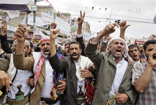 Anti-government protestors, shout slogans during a demonstration demanding the resignation of Yemeni President Ali Abdullah Saleh, in Sanaa, Yemen, Saturday, May 28, 2011. Fighting that rocked Sanaa for the past five days spread beyond the capital on Friday as Yemeni tribesmen opposed to the rule of President Ali Abdullah Saleh seized a Republican Guard military camp in battles that left dozens dead and prompted airstrikes by government warplanes, according to a tribal leader. (AP Photo/Hani Mohammed) (AP)