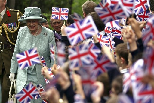 FILE - In this May 16, 2008 file photo, Britain's Queen Elizabeth II, left, is welcomed by children waving Britain's flag, upon her arrival at the British Embassy in Ankara, Turkey. Encouraged by the largely successful peace process in Northern Ireland, which has made her sensitive visit feasible, the queen will become the first British monarch to set foot in the Republic of Ireland on Tuesday, May 17, 2011. When a British sovereign last came, a full century ago, all of Ireland was still part of the United Kingdom. (AP Photo/Firat Yurdakul, Pool) (AP)