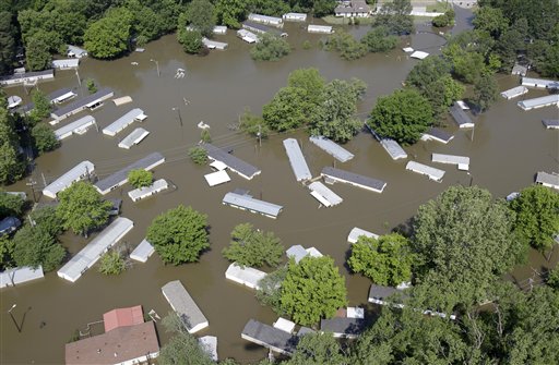 A flooded residential area is seen in this aerial photograph Tuesday, May 10, 2011, in Memphis, Tenn. The Mississippi River crested in Memphis at nearly 48 feet on Tuesday, falling short of its all-time record but still soaking low-lying areas with enough water to require a massive cleanup. (AP Photo/Jeff Roberson) (AP)