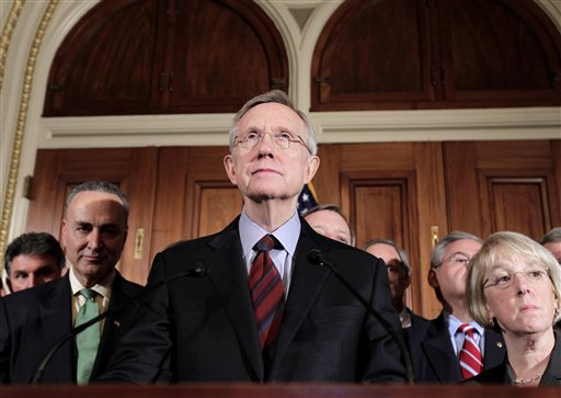 Senate Majority Leader Harry Reid, D-Nev. pauses during a news conference on Capitol Hill in Washington, Friday, April 8, 2011, after meeting with the Senate Democratic Caucus. From left are: Sen. Joe Manchin, D-W.Va., Sen. Charles Schumer, D-N.Y., Reid, and Senate Majority Whip Richard Durbin of Ill., Sen. Thomas Carper, D-Del., Sen. Robert Menendez, D-N.J., and Sen. Patty Murray, D-Wash. (AP Photo/J. Scott Applewhite) (AP)