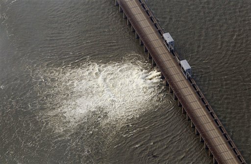 Water diverted from the Mississippi River spills through a bay in the Morganza Spillway in Morganza, La., Saturday, May 14, 2011. Water from the inflated Mississippi River gushed through a floodgate Saturday for the first time in nearly four decades and headed toward thousands of homes and farmland in the Cajun countryside, threatening to slowly submerge the land under water up to 25 feet deep. (AP Photo/Patrick Semansky) (AP)