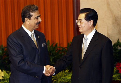 Pakistani Prime Minister Yousuf Raza Gilani, left, is welcomed by Chinese President Hu Jintao for a meeting at the Great Hall of the People in Beijing Friday, May 20, 2011.