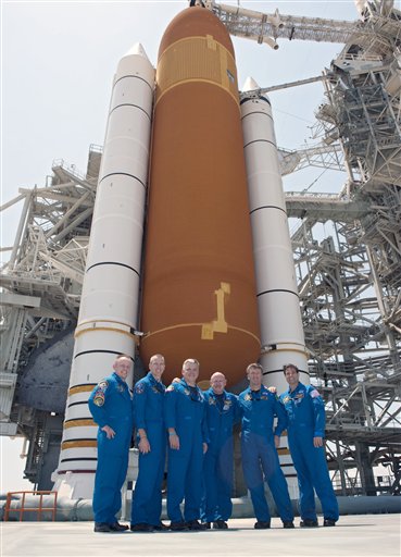 In this picture made available by NASA, the last crew of the space shuttle Endeavour stands together on Launch Pad 39A in front of its external fuel tank and solid rocket boosters at the Kennedy Space Center in Cape Canaveral, Fla. on Thursday, April 28, 2011, one day before its final flight. From left are Mission Specialists Michael Fincke, Andrew Feustel, Pilot Greg H. Johnson, Commander Mark Kelly, European Space Agency astronaut Roberto Vittori and Mission Specialist Greg Chamitoff. (AP Photo/NASA, Kim Shiflett) (AP)