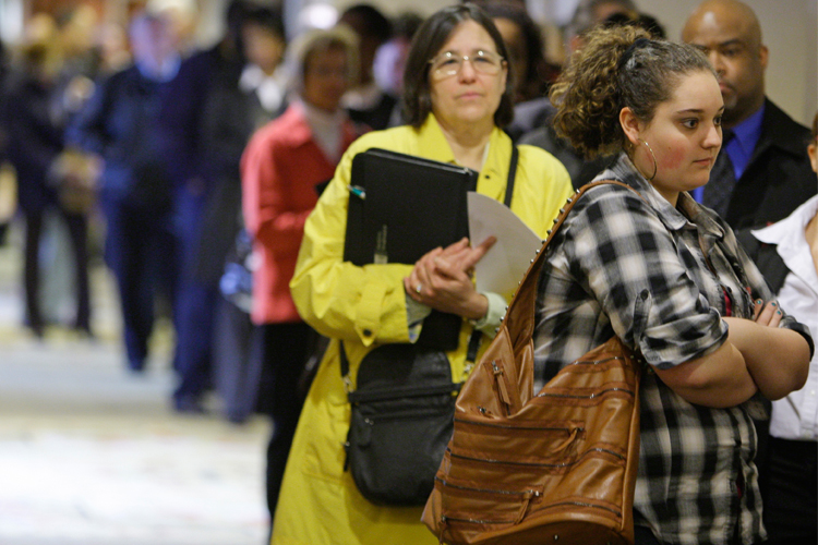 Job seekers wait in line for a job fair to open in Independence, Ohio, on May 3.