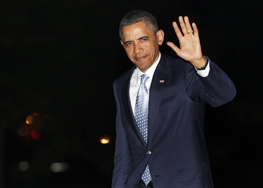 President Barack Obama waves to media as he walks from Marine One to the White House, Wednesday, May 11, 2011, in Washington, as he travels from Texas. (AP Photo/Carolyn Kaster) (AP)