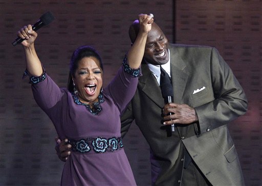 Oprah Winfrey reacts as Michael Jordan appears during a star-studded double-taping of "Surprise Oprah! A Farewell Spectacular," Tuesday, May 17, 2011, in Chicago. "The Oprah Winfrey Show" is ending its run May 25, after 25 years, and millions of her fans around the globe are waiting to see how she will close out a show that spawned a media empire. (AP Photo/Charles Rex Arbogast) (AP)