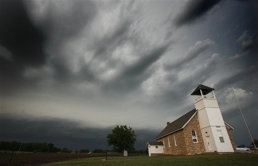 Storms clouds pass behind Buck Creek School near Lawrence, Kan., Saturday, May 21, 2011. (AP Photo/Orlin Wagner) (AP)