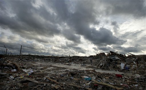 Storm clouds pass over the devastated Greenbriar Nursing Home in Joplin, Mo. Wednesday, May 25, 2011. Eleven residents of the facility died when an EF-5 tornado tore through much of the city Sunday, damaging a hospital and hundreds of homes and businesses and killing at least 122 people. (AP Photo/Charlie Riedel) (AP)