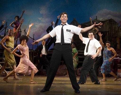 In this theater publicity image released by Boneau/Bryan-Brown, Andrew Rannells, center, performs with an ensemble cast in "The Book of Mormon" at the Eugene O'Neill Theatre in New York. (AP Photo/Boneau/Bryan-Brown, Joan Marcus) (AP)