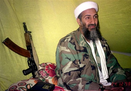 FILE - In this Dec. 24, 1998 file photo, Muslim militant and al-Qaida leader Osama Bin Laden speaks to a selected group of reporters in mountains of Helmand province in southern Afghanistan. The Americans who raided bin Laden's lair met far less resistance than the Obama administration described in the aftermath, according to its latest account. The commandos encountered gunshots from only one man, whom they quickly killed, before sweeping the house and shooting others, who were unarmed, a senior defense official said. (AP Photo/Rahimullah Yousafzai, File) (AP)