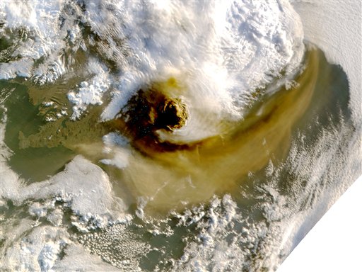 This image provided by NASA shows an image taken by a NASA MODIS satellite acquired at 1:15 a.m. EDT  on May 22, 2011 shows the ash plume from the Grimsvotn volcano casts shadow to the west. The Grimsvotn volcano began erupting on Saturday, May 21 sending clouds of ash high into the air. The amount of ash spewing from the volcano tapered off dramatically on Tuesday, however, said Elin Jonasdottir, a forecaster at Iceland's meteorological office.  The blue dots are data dropouts probably caused by the very bad light in the shadow of the plume. (AP Photo/NASA) (AP)