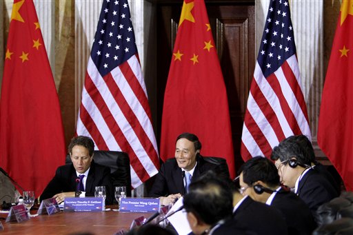 Treasury Secretary Timothy Geithner meets with China's Vice Premier Wang Qishan, center, during the US-China Strategic and Economic Dialogue meetings, Monday, May 9, 2011, at the Treasury Department in Washington. (AP Photo/Jacquelyn Martin) (AP)