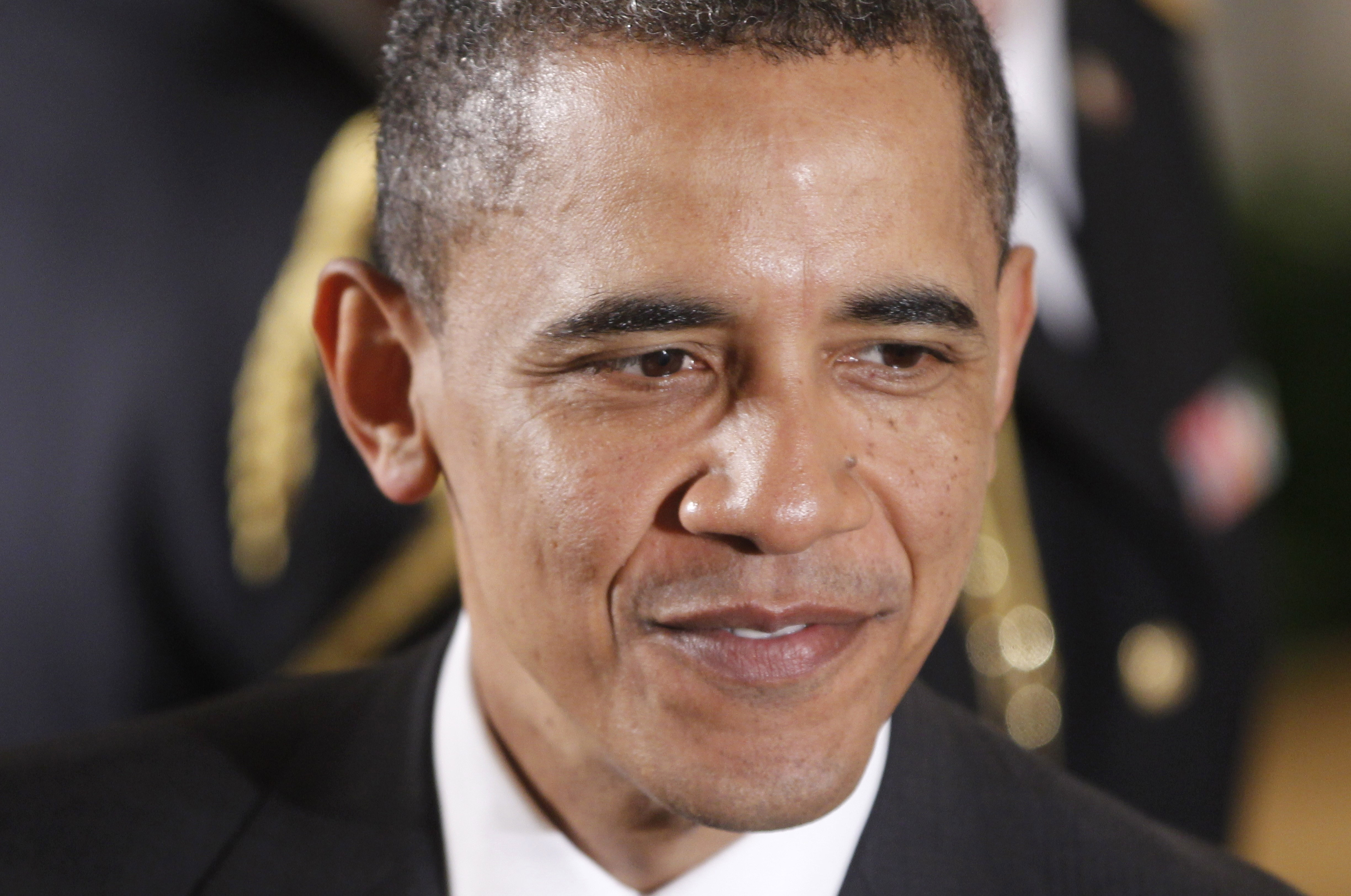 President Barack Obama greets guests in the East Room of the White House in Washington, Monday, May 2, 2011, following a ceremony where he awarded the Medal of Honor posthumously to U.S. Army Private First Class Anthony T. KahoÍohanohano and U.S. Army Private First Class Henry Svehla for conspicuous gallantry during the Korean War. (AP Photo/Charles Dharapak) (Associated Press)