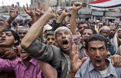 Anti-government protestors react during a demonstration demanding the resignation of Yemeni President Ali Abdullah Saleh, in Sanaa,Yemen, Thursday, May 5, 2011. Yemen, which is currently wracked by the popular protests against the country's deeply unpopular president, is also home to one of the most active branches of al-Qaida, which has planned several attacks against the U.S. (AP Photo/Hani Mohammed) (AP)