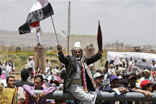 An anti-government protestor, reacts during a demonstration demanding the resignation of Yemeni President Ali Abdullah Saleh, in Sanaa, Yemen, Friday, June 3, 2011. A government official says Yemen's president was lightly injured and four top officials wounded when opposition tribesmen struck his palace with rockets Friday. (AP Photo/Hani Mohammed) (AP)