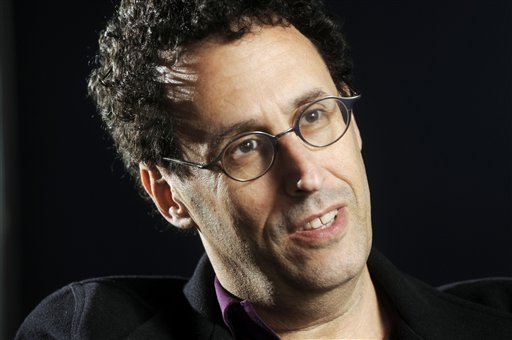 FILE - In this April 30, 2009 photo, Tony Kushner is shown during a break from rehearsal of his new play at the Guthrie Theatre in Minneapolis, Minn.,  Kushner won a Pulitzer Prize for "Angels in America," his epic play about the AIDS epidemic, and is a New York literary fixture who has received more than a dozen honorary degrees from American colleges and universities.  So it was a shock when the Board of Trustees of the City University of New York voted last month to withhold a promised honorary degree after a trustee said the playwright was anti-Israel. CUNY later backtracked under a barrage of criticism, and Kushner will accept his degree on Friday, June 2, 2011. (AP Photo/Craig Lassig) (AP)