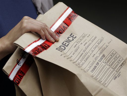 An FBI agent holds an evidence bag outside an apartment complex where fugitive crime boss James "Whitey" Bulger and his longtime companion Catherine Greig were arrested in Santa Monica, Calif., Thursday, June 23, 2011. The Boston mob boss was captured near Los Angeles after 16 years on the run that embarrassed the FBI and exposed the bureau's corrupt relationship with its underworld informants. (AP Photo/Jae C. Hong) (AP)