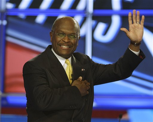 Businessman Herman Cain waves as he takes the stage before the first New Hampshire Republican presidential debate at St. Anselm College in Manchester, N.H., Monday, June 13, 2011. (AP Photo/Stephan Savoia) (AP)