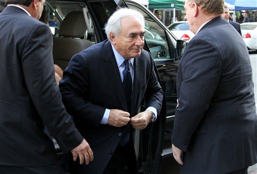 Dominique Strauss-Kahn, center, walks towards the Manhattan Criminal Courts building Monday, June 6, 2011 in New York as he arrives for his arraignment proceedings. (AP Photo/Craig Ruttle) (AP)