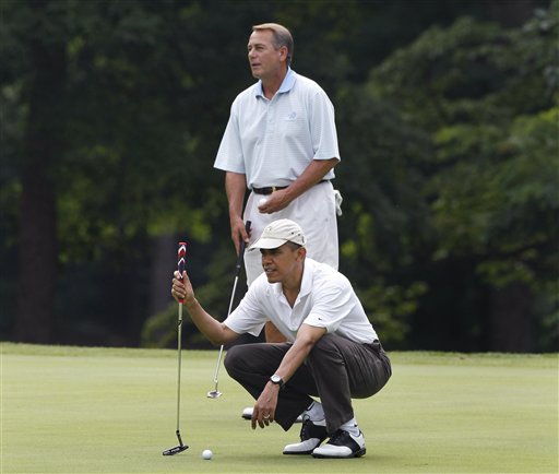 President Barack Obama and House Speaker John Boehner, R-Ohio, are on the first hole as they play golf at Andrews Air Force Base, Md.,  Saturday, June 18, 2011. (AP Photo/Charles Dharapak) (AP)