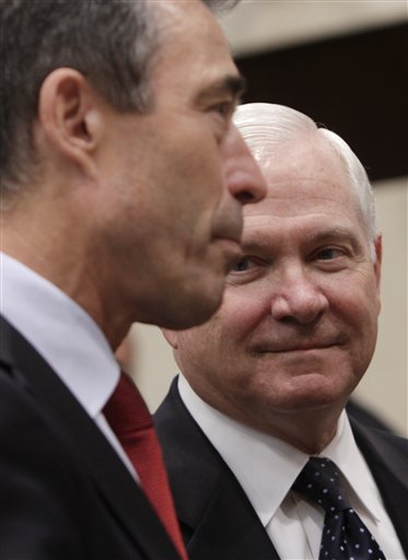 U.S. Defense Secretary Robert Gates, right, looks at NATO Secretary-General Anders Fogh Rasmussen during a round table meeting of NATO defense ministers at NATO headquarters in Brussels on Thursday, June 9, 2011. NATO defense ministers shift their focus from Libya to Afghanistan during talks on Thursday. (AP Photo/Virginia Mayo) (AP)