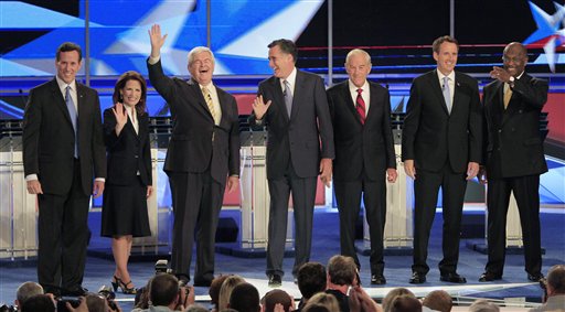Rep. Michele Bachmann, R-Minn., and former House Speaker Newt Gingrich talk during a break in the first New Hampshire Republican presidential debate at St. Anselm College in Manchester, N.H., Monday, June 13, 2011. (AP Photo/Stephan Savoia) (AP)