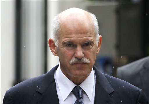 Greek Prime Minister George Papandreou, arrives the Presidential Palace before his meeting with the Greek President Karolos Papoulias, in central Athens, on Wednesday, June 15, 2011.Papandreou and conservative party leader Antonis Samaras discussed the creation of a power-sharing government to deal with the country's crippling debt crisis during a telephone conversation, an opposition party official told The Associated Press. The official spoke on condition of anonymity because the negotiations were still ongoing. The official said the conservatives' conditions for participating in a potential grand coalition were that Papandreou leaves his current position as prime minister, and the new government re-negotiate the bailout agreement. (AP Photo/Petros Giannakouris) (AP)