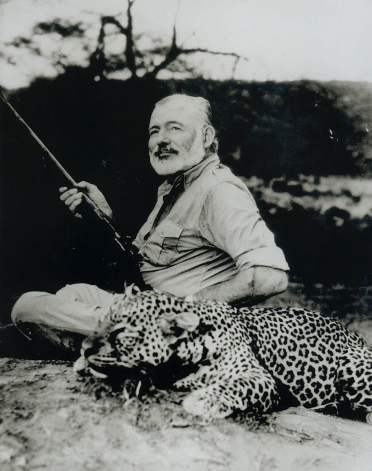 Ernest Hemingway poses with a dead leopard in 1953, part of an exhibit of Hemingway photos to celebrate his 100th birthday on display at Washington's National Portrait Gallery through Nov. 7, 1999. Hemingway, who killed himself three weeks before his 61st birthday, would have been 100 on July 21. (AP Photo/National Portrait Gallery, Earl Theisen) (Earl Theisen)
