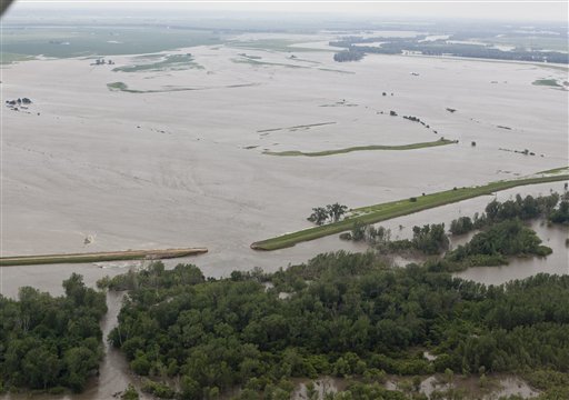 An aerial view of a ruptured levee near Hamburg, Iowa, Monday, June 13, 2011, which was letting in water from the Missouri river. The rising Missouri River has ruptured two levees in northwest Missouri, sending torrents of floodwaters over rural farmland toward the Iowa town of Hamburg and the Missouri resort town of Big Lake. (AP Photo/Nati Harnik) (AP)