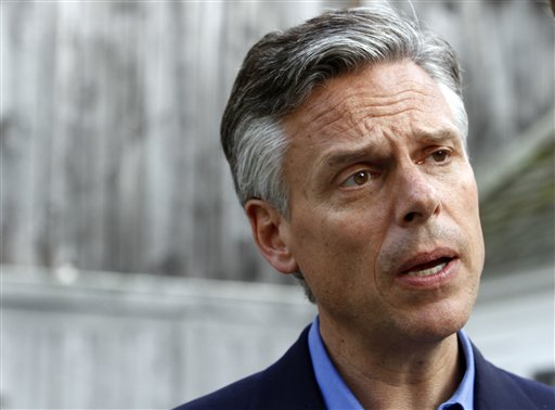 Possible 2012 presidential hopeful, former Republican Gov. Jon Huntsman, Jr., of Utah, speaks to a reporter at a gathering at the home of Nancy and Wally Stickney in Salem, N.H. Friday, June 10, 2011. (AP Photo/Elise Amendola) (AP)