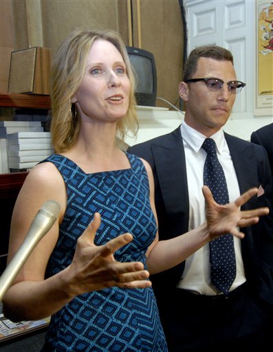 Actress Cynthia Nixon, left, and New York Rangers' Sean Avery talk with reporters after asking lawmakers to pass legislation to legalize same-sex marriage in New York at the Capitol in Albany, N.Y., Tuesday, June 14, 2011.  The New York state Senate's Republican majority is facing an all-out effort by Democrats to legalize gay marriage in the last days of the session and reinvigorate the national movement.   (AP Photo/Hans Pennink) (AP)