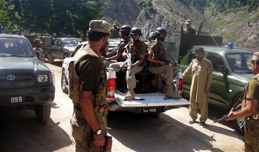 Troops of Pakistan army seen at Shaltalo in the Upper Dir region of Pakistan on Monday, June 6, 2011. Pakistani security forces had  battles  with militants in the Pakistani border town of Shaltalo along the Afghanistan border.  Pakistani helicopters and artillery forced back militants who crossed over from Afghanistan  and triggered battles that have killed many people, an official said. (AP Photo/Dilawar Jan) (AP)